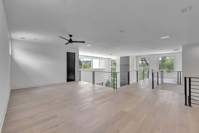 spare room with light hardwood / wood-style flooring and plenty of natural light