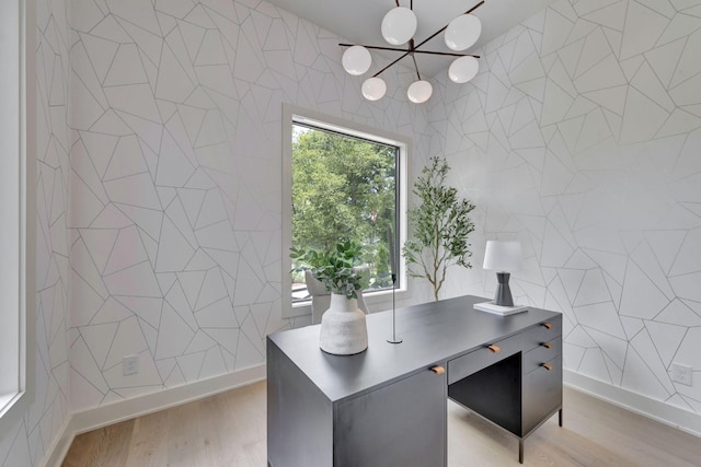 office space featuring tile walls and light hardwood / wood-style floors