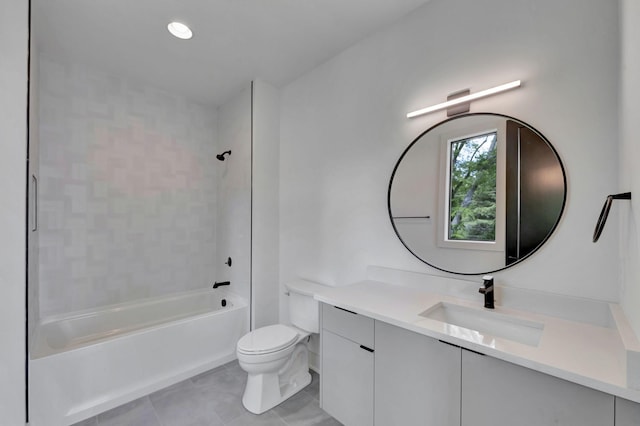 full bathroom featuring vanity, tiled shower / bath combo, tile patterned floors, and toilet