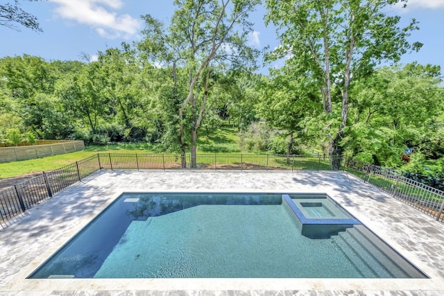 view of pool with an in ground hot tub and a patio