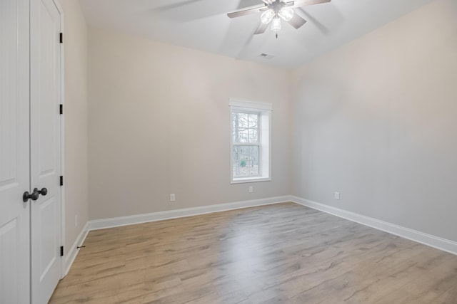 unfurnished room with light hardwood / wood-style floors and ceiling fan