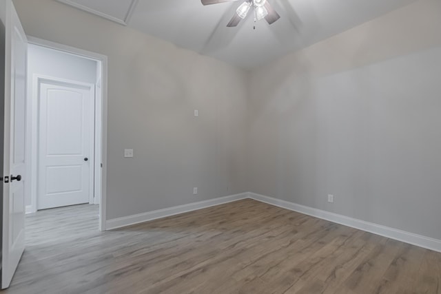 empty room featuring ceiling fan and light hardwood / wood-style floors