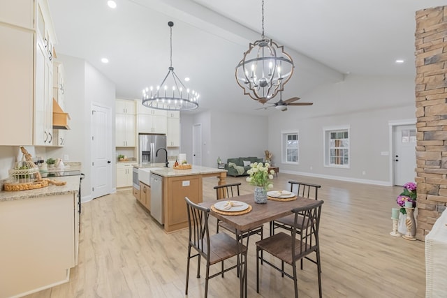 dining room with sink, high vaulted ceiling, light hardwood / wood-style floors, beam ceiling, and ceiling fan with notable chandelier