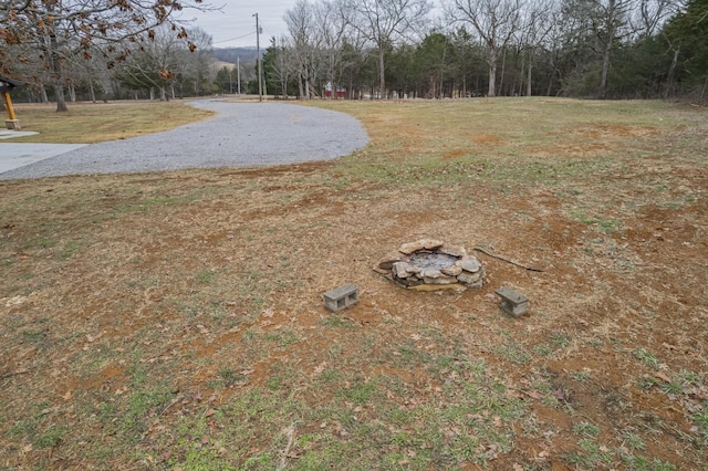 view of yard featuring a fire pit