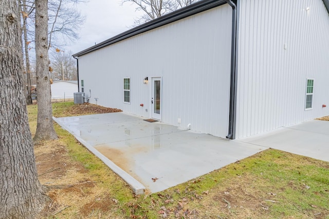 view of property exterior featuring central AC and a patio