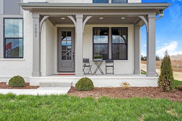 doorway to property featuring covered porch