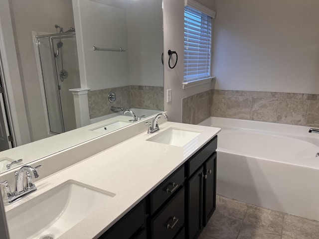 bathroom featuring vanity and shower with separate bathtub