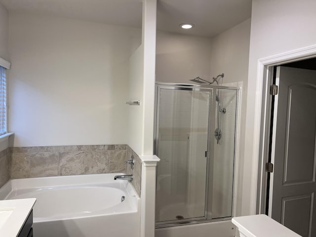 bathroom featuring vanity and separate shower and tub