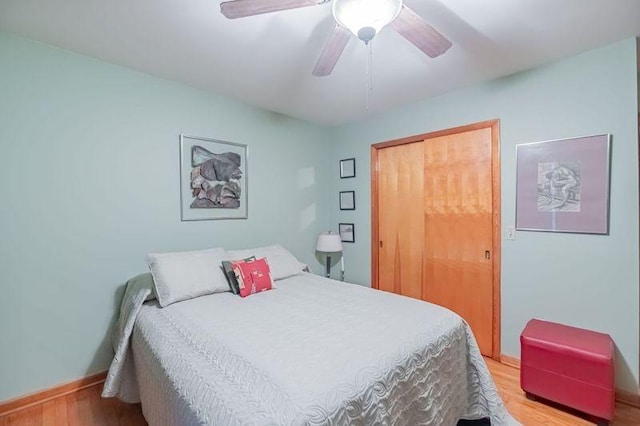 bedroom with ceiling fan and light hardwood / wood-style flooring