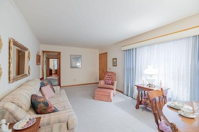 carpeted living room featuring crown molding