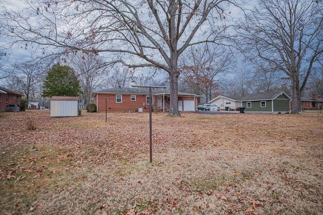 view of yard featuring a garage