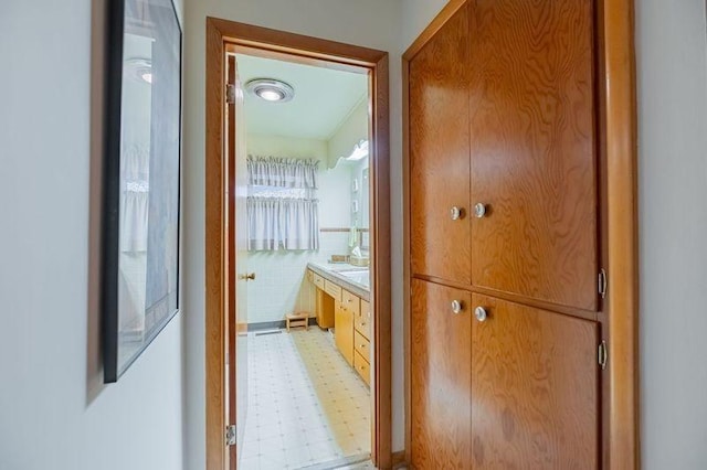 hallway with tile walls