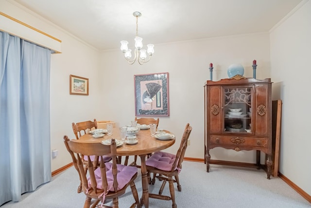 carpeted dining space featuring crown molding and an inviting chandelier