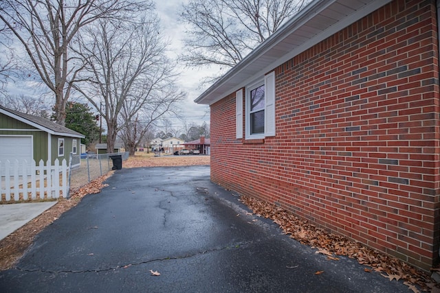 view of side of property with an outbuilding and a garage