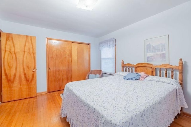 bedroom featuring a closet and light wood-type flooring