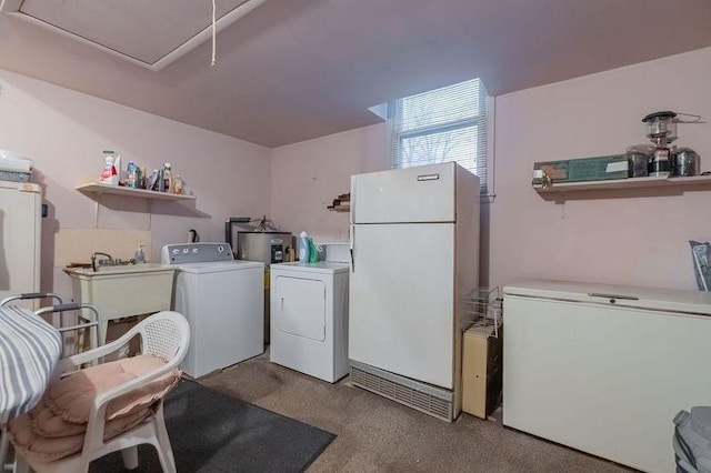 laundry area with sink and washer and clothes dryer