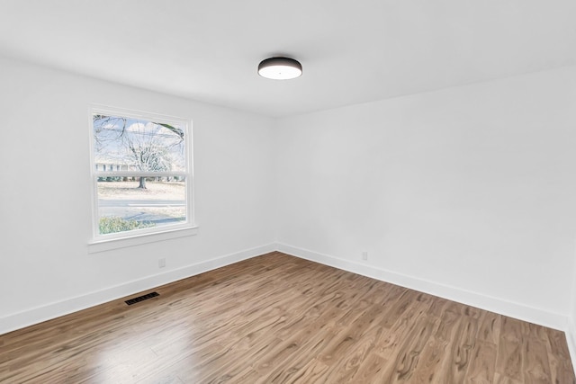 empty room featuring wood-type flooring