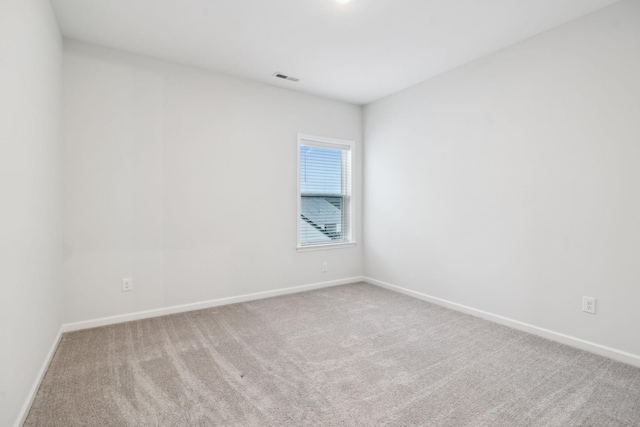 unfurnished room with carpet flooring