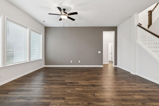 unfurnished room featuring ceiling fan and dark hardwood / wood-style floors