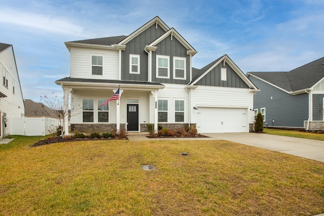 craftsman-style home featuring a garage and a front lawn