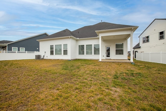 back of house with a yard