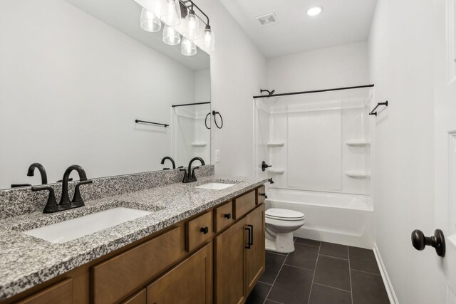 full bathroom featuring tile patterned flooring, vanity, shower / bathtub combination, and toilet