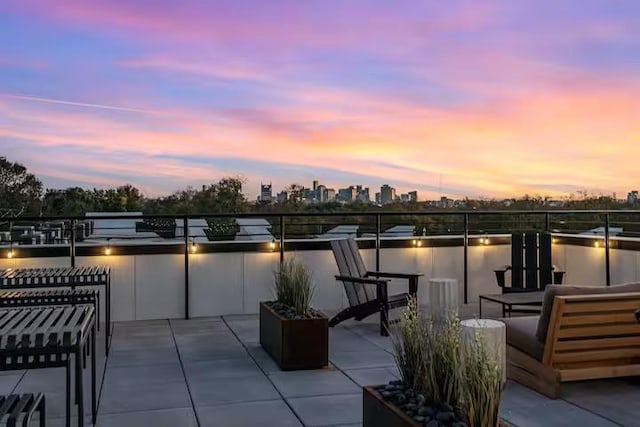 patio terrace at dusk with a water view