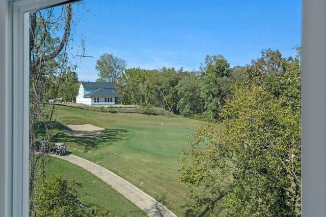 view of property's community featuring a yard