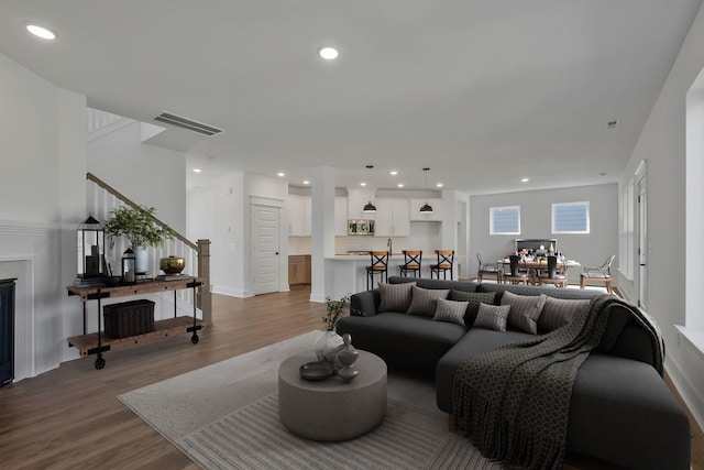 living room with light hardwood / wood-style floors