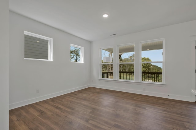 unfurnished room featuring dark hardwood / wood-style floors