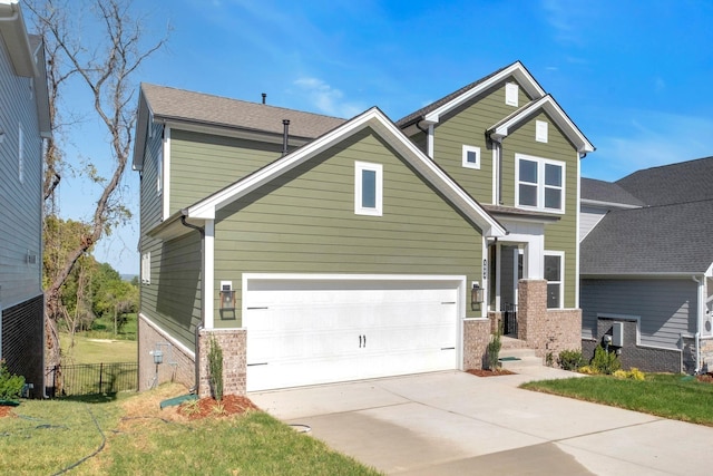 craftsman-style home with a garage and a front yard