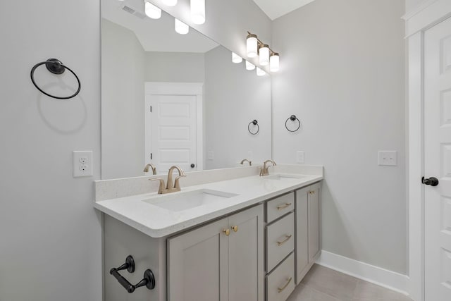 bathroom with vanity and tile patterned flooring