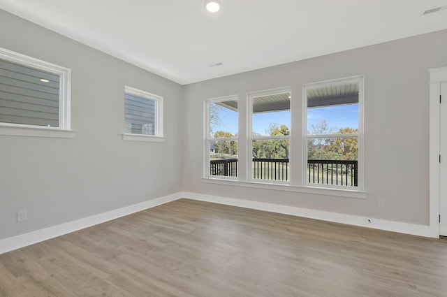 unfurnished room featuring light hardwood / wood-style flooring