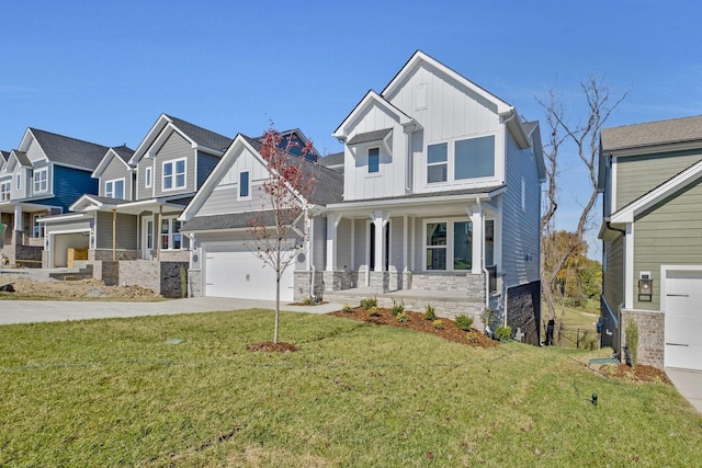 craftsman-style house with a garage, a front yard, and covered porch