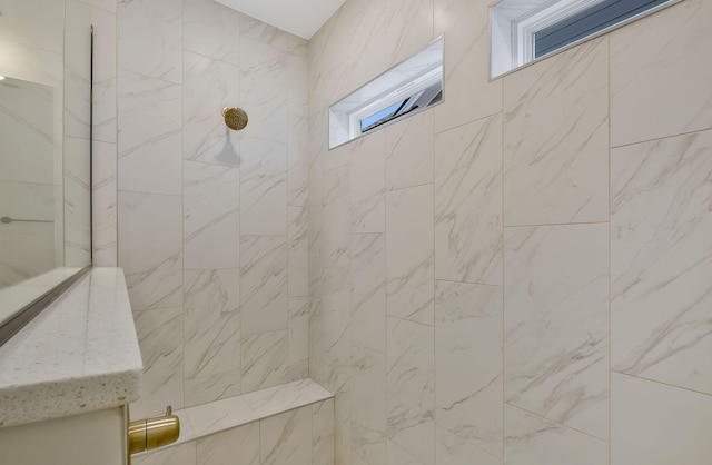 bathroom featuring tiled shower