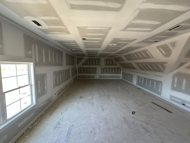 spare room with vaulted ceiling