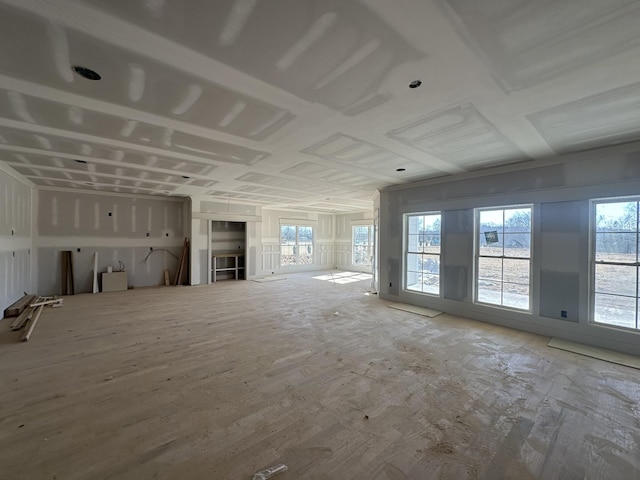 unfurnished living room with a wealth of natural light