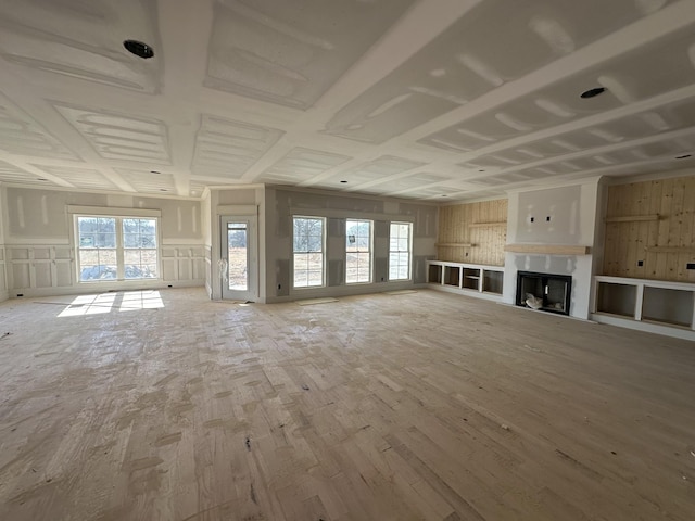 unfurnished living room featuring wood-type flooring