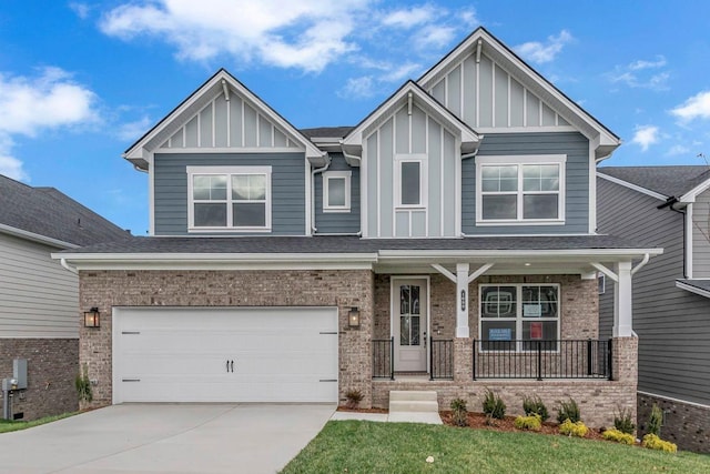 craftsman-style house with a porch, a garage, and a front lawn