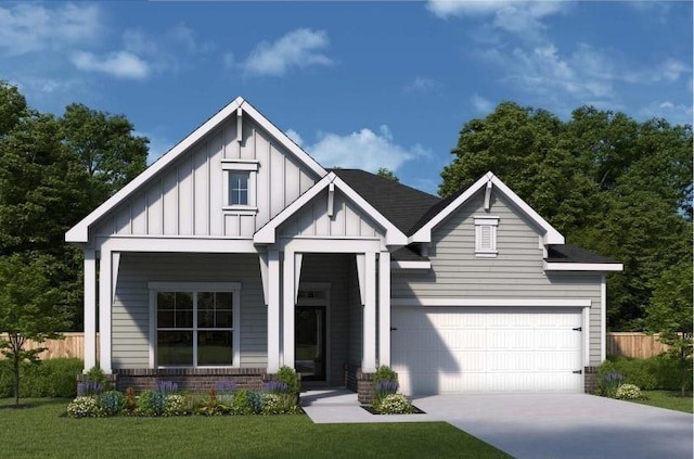 view of front of property featuring a garage and a front yard