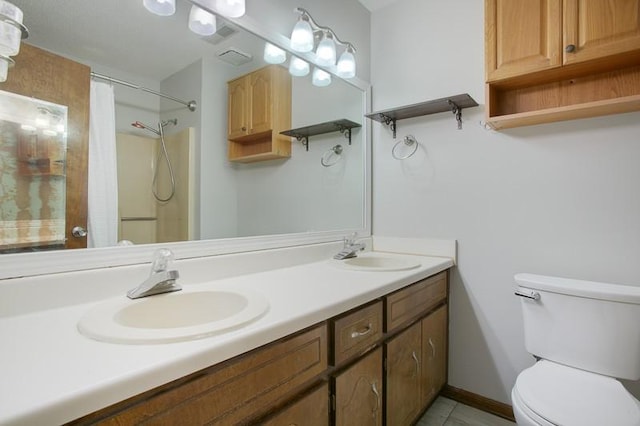 bathroom with vanity, walk in shower, and toilet