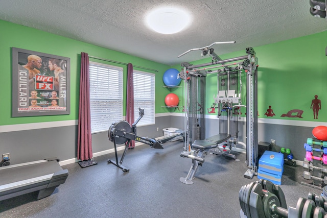 workout area with a textured ceiling