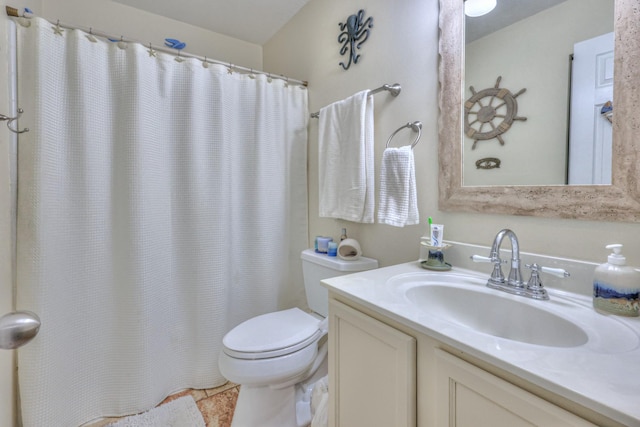 bathroom with vanity, toilet, and walk in shower