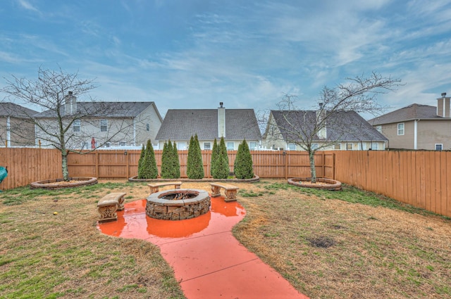 view of yard with a patio and an outdoor fire pit