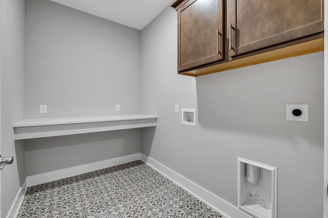 laundry room featuring cabinet space, hookup for an electric dryer, hookup for a washing machine, and baseboards