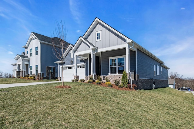 view of front of home with a front yard, brick siding, board and batten siding, and driveway