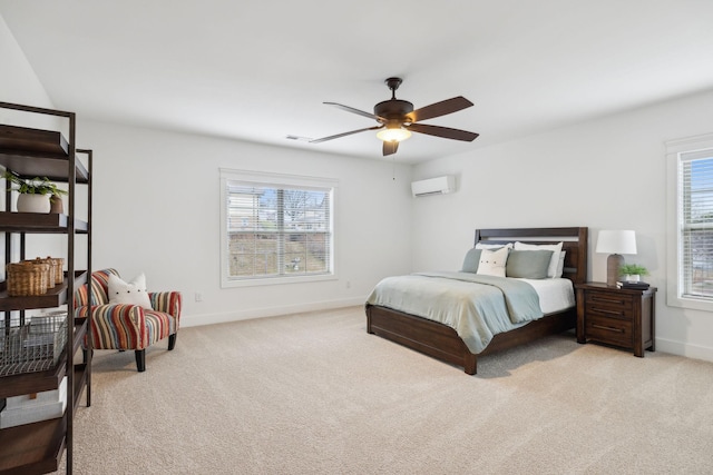 bedroom featuring a wall mounted AC, light colored carpet, and ceiling fan