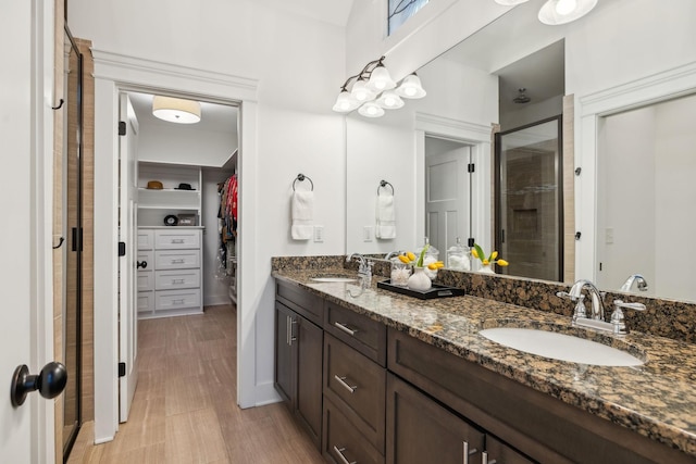 bathroom with vanity and walk in shower