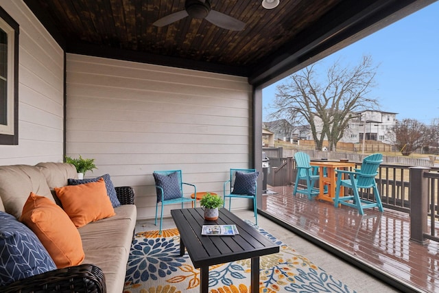 deck with ceiling fan and outdoor lounge area