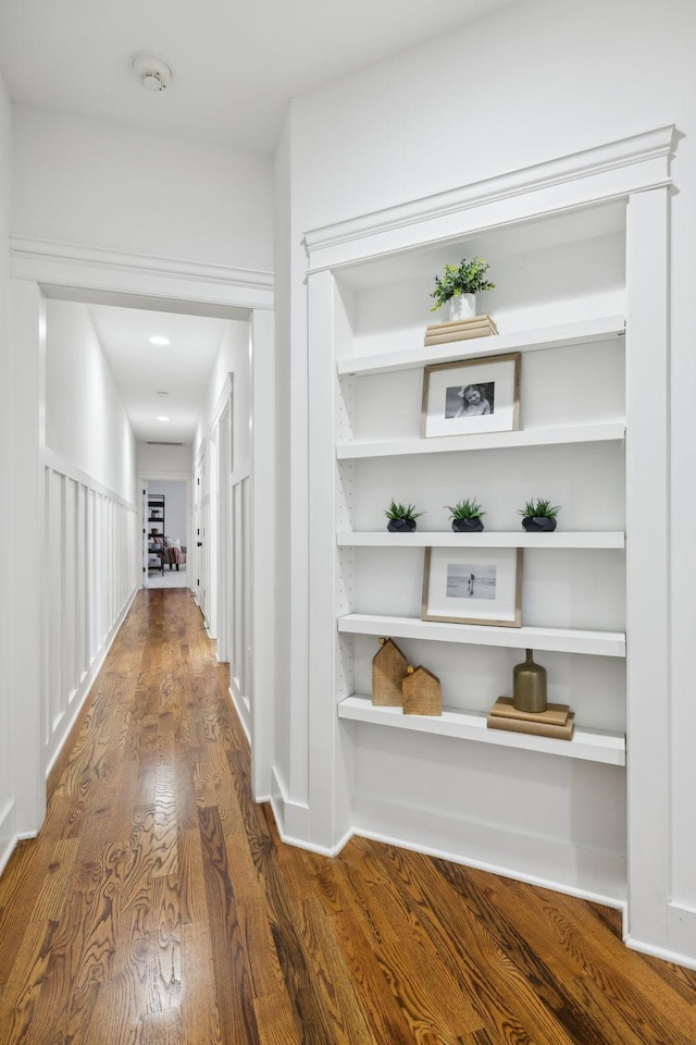 corridor featuring dark hardwood / wood-style floors